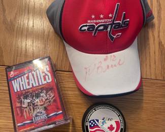 Caps hat signed by Peter Bondra, Wheaties box is collector edition with gold signature.