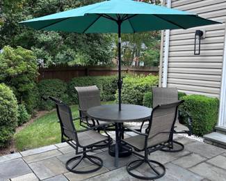 Table with 4 chairs and umbrella. Under 2 years old and barely used.