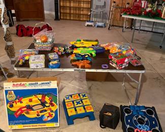 Children’s games, water, guns, bocce ball set, ping-pong, balls, and assorted kids balls.
