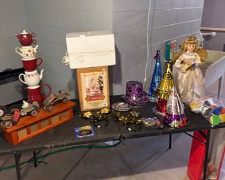 Party supplies, knickknack shelf, and teacup art.