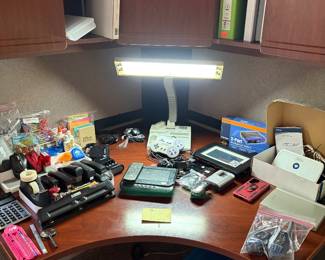 Desk, lamp, office supplies, audiovox CD player. Walkman, game controllers Motorola  phones and more.  Desk is not for sale.
