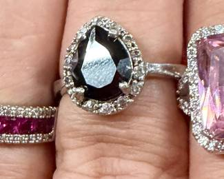 Three Sterling rings with possible rubies in the small one