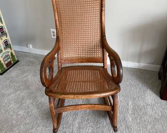 Restored caned Lincoln rocking chair $75