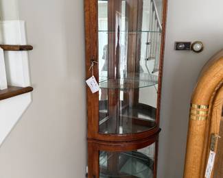Curved glassed corner curio cabinet $200
