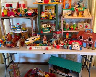 Lots of Fisher-Price little people, vintage pull toys, and more