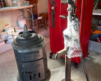 Cast-iron stove, water pump, Coca-Cola machine