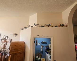 Zoom in plant shelf . Very cool model helicopters and planes at upcoming estate sale