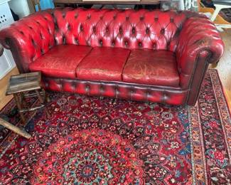 75% off red leather sofa  reg price 750. sale price 187.50
