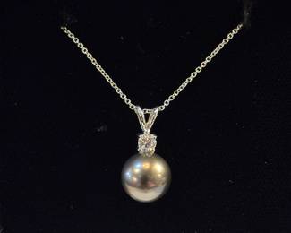 Black pearl and diamond pendant 