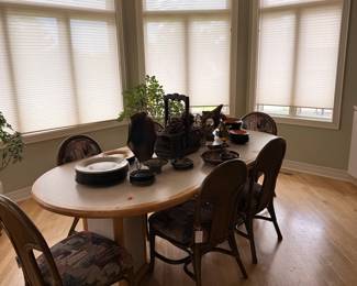 Oval Dining Table with Woven Cane Chairs