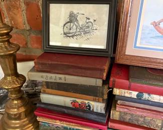 Antique books and bicycle prints
