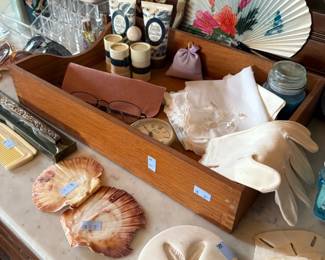 Seashells, hand fans, and vintage linens