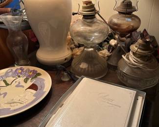 Oil lamps, ginger jar lamp, and photo album