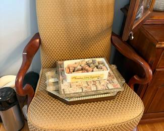 Stone specimens and upholstered chair