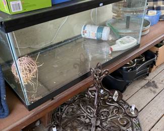 Glass aquarium and wrought iron decor