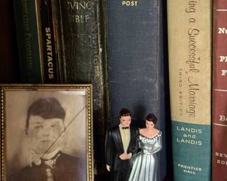 Vintage books and wedding cake toppers