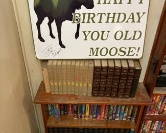 Novelty birthday sign and books
