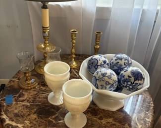 Blue and white porcelain balls, milk glass, and brass candlesticks