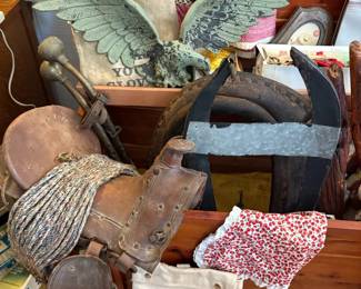 Antique horse harness, cast iron eagle, and feed bag