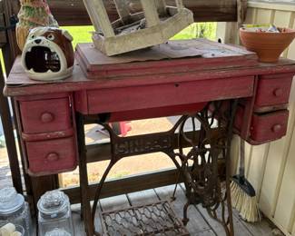 Red treadle sewing machine base and birdhouse