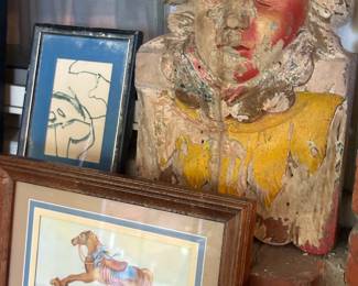 Weathered figural bust and rocking horse print