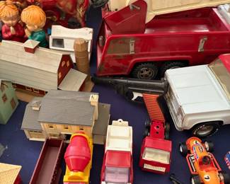 Tonka fire truck, toy houses, and cap gun