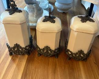 Ceramic canister set with ornate bases