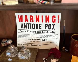 Novelty sign, inkwells, and skeleton key