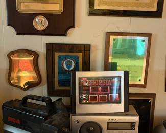 Award plaques, radio, and camcorder