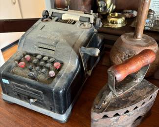 Antique cash register and sad iron