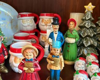 Christmas caroler figurines and Santa mugs