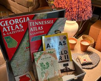 Vintage suitcase with road atlases