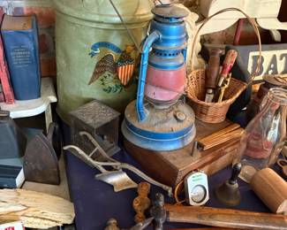 Antique sad irons and tins