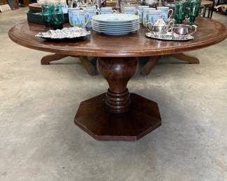 parquetry wood pedestal table