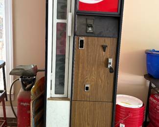 Vintage slant coke machine.  Does not cool but we do have original keys