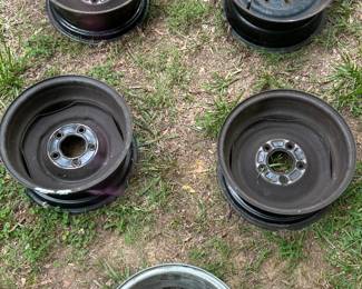 Vintage automotive wheels or brake drums.