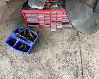 Red small part organizer with two welding shields and screws and bolts