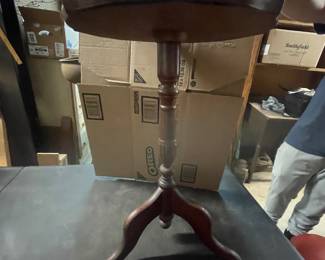 Circle top table with leather top wood trim