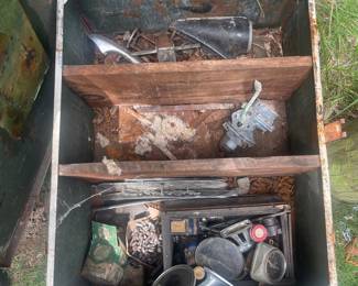 metal trunk with assortment of parts