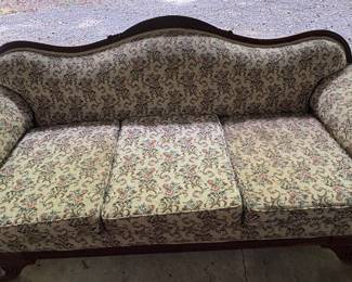 Victorian-style camelback sofa