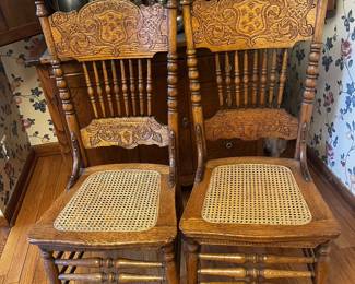 There is a set of 4 cane chairs
