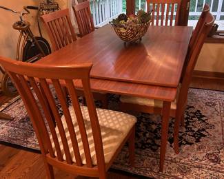 Teak dining table with 8 chairs and two hidden leaves