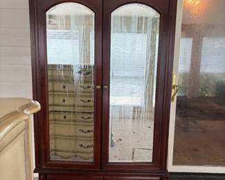 Large armoire that matches king bedroom set.
