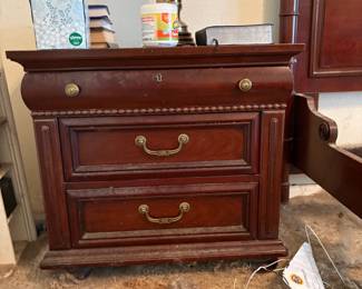 One of 2 nightstands matching king bed and dresser.