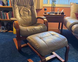 2 matching leather chairs with ottomans