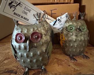 Metal owls. Not named Athena. Discount table. 