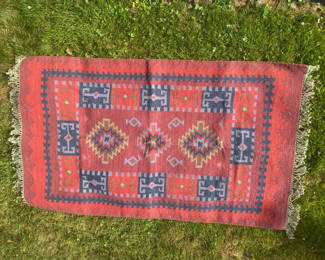 Lot 108: Handwoven cotton rug with geometric red and blue pattern