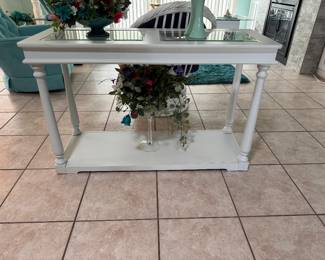 Coastal white rattan sofa table featuring a beveled glass top and classic bamboo-inspired design. Perfect behind a sofa, in a foyer, hallway, or Florida room to complement coastal, tropical, or island décor.