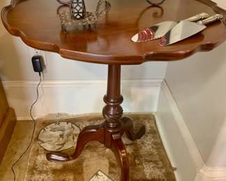 Victorian era mahogany tea table with tripod legs--notice two sterling cake servers