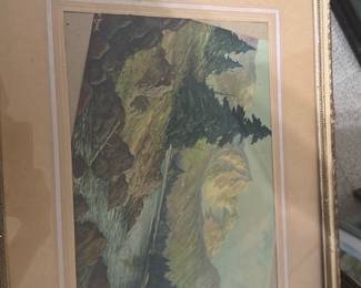 Framed Landscape Watercolor Print — Framed landscape artwork depicting mountains, trees and a flowing river, presented with a double mat and gilt frame; photographed in the bonus up room. The piece appears to be a watercolor or color print on paper with a beige/tan mat and decorative gold-tone frame. Overall framed size measured visually is moderate and it would display well in a living room, hallway or study. Frame shows light wear and scuffs at corners and mat has minor age toning; artwork surface appears intact with no visible tears or major discoloration.